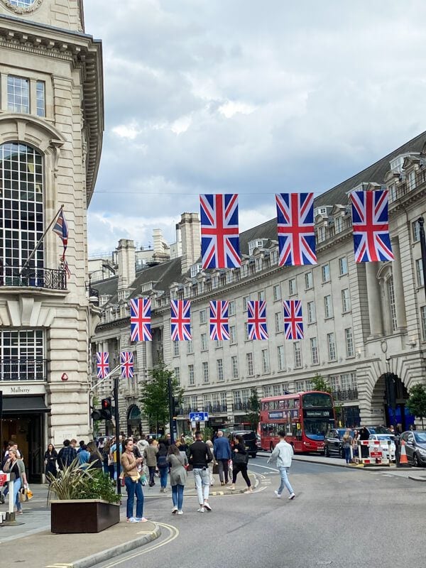 Famous Regent Street of London decorated with British flags and the beautiful Gorgian buildings.