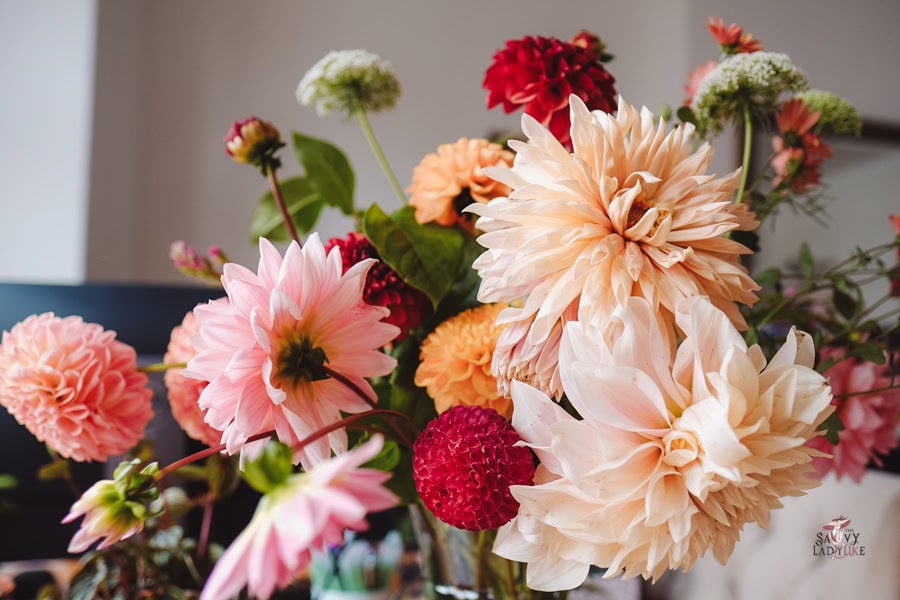 How to Reinvent Yourself Into The Woman You've Always Admired 8 A vase filled with flowers is on a table, creating an elegant environment that reflects your new identity.